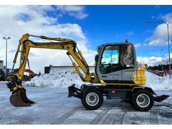 New Holland MH 2.6 Pyörittäjällä  - bager točkaš