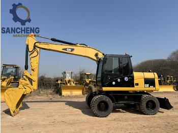 Bager točkaš CATERPILLAR M320