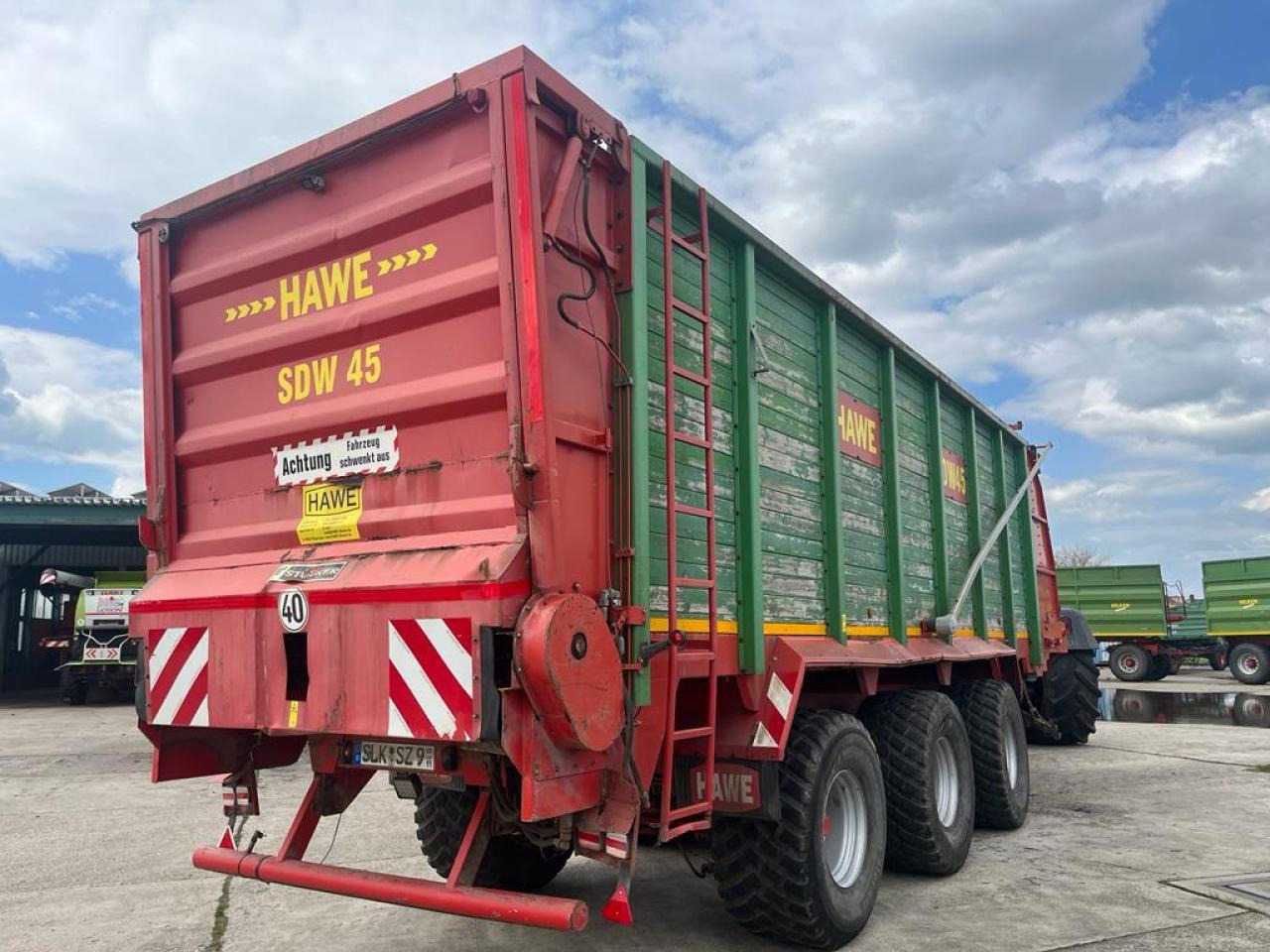 HAWE Tridem SDW 45T mit Heckentleerung - Traktorska prikolica za farmu/ Kiper: slika 3 HAWE Tridem SDW 45T mit Heckentleerung - Traktorska prikolica za farmu/ Kiper: slika 3