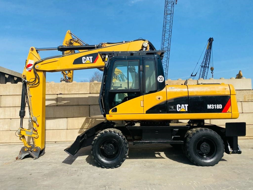 CAT M 318 D - Bager točkaš: slika 1 CAT M 318 D - Bager točkaš: slika 1
