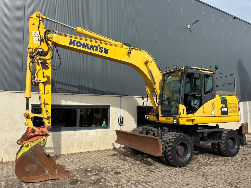 Komatsu PW 160-7 - PW160 - PW 160 - PW 180 - PW 140 - Bager točkaš: slika 1 Komatsu PW 160-7 - PW160 - PW 160 - PW 180 - PW 140 - Bager točkaš: slika 1