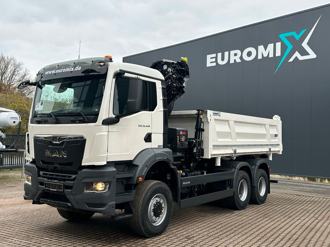 MAN TGS 33.440 6x6 /3-Seiten- Kipper / Kran HIAB 302 - Istovarivač, Kamion sa dizalicom: slika 1 MAN TGS 33.440 6x6 /3-Seiten- Kipper / Kran HIAB 302 - Istovarivač, Kamion sa dizalicom: slika 1