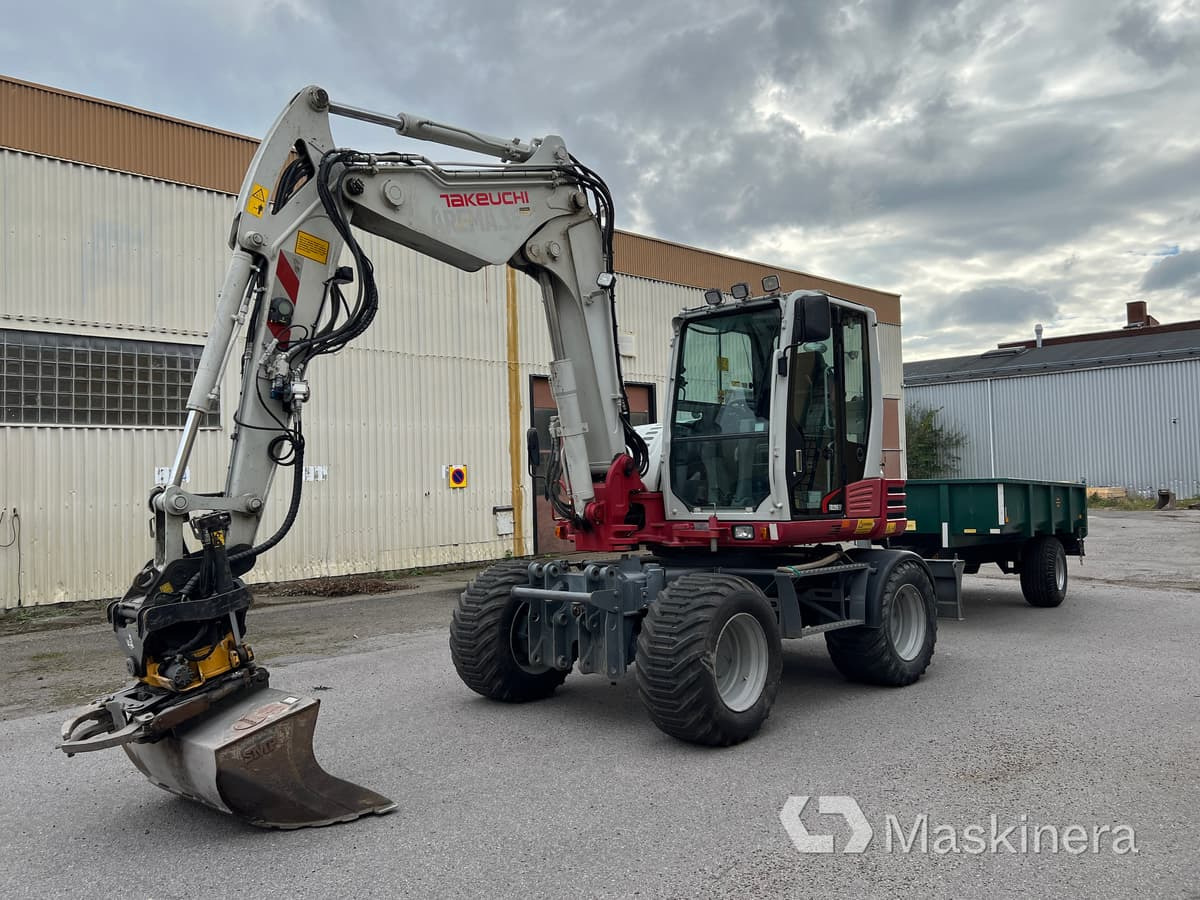 Hjulgrävare Takeuchi TB295W med vagn & redskap - Bager guseničar: slika 1 Hjulgrävare Takeuchi TB295W med vagn & redskap - Bager guseničar: slika 1
