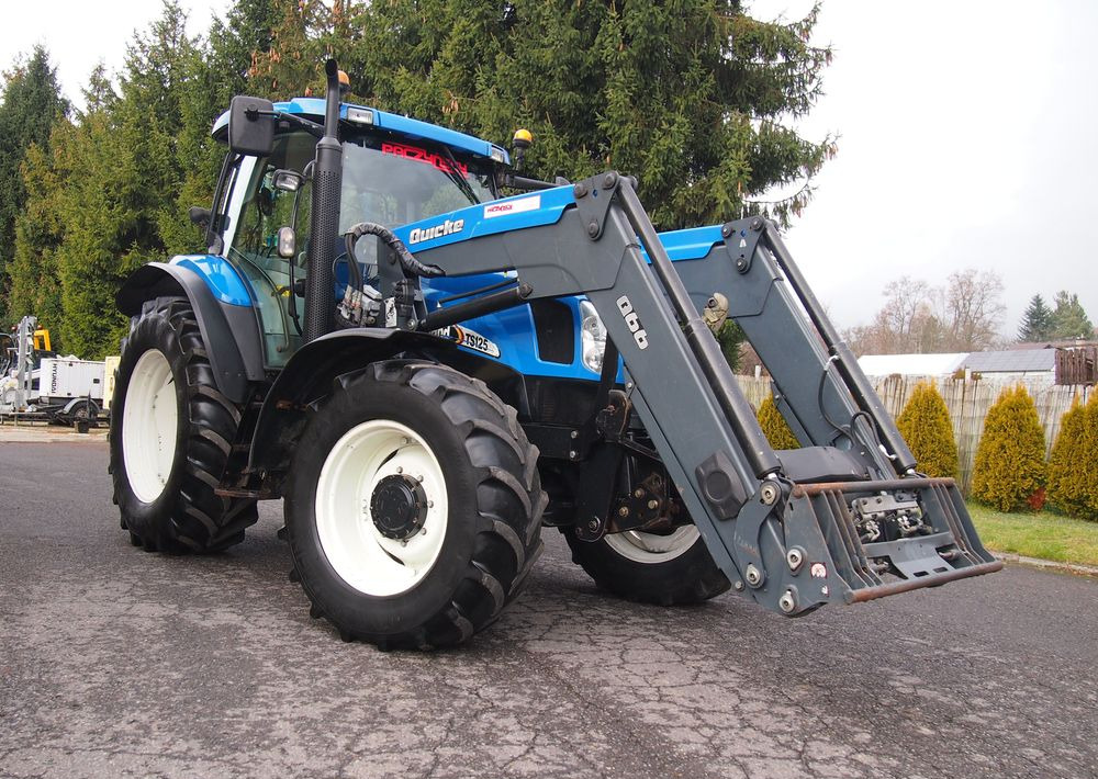 Ciągnik New Holland NH TS125A 6 cylindrów 2004 Ciągnik rolniczy New Holland TS125A - Traktor: slika 2 Ciągnik New Holland NH TS125A 6 cylindrów 2004 Ciągnik rolniczy New Holland TS125A - Traktor: slika 2