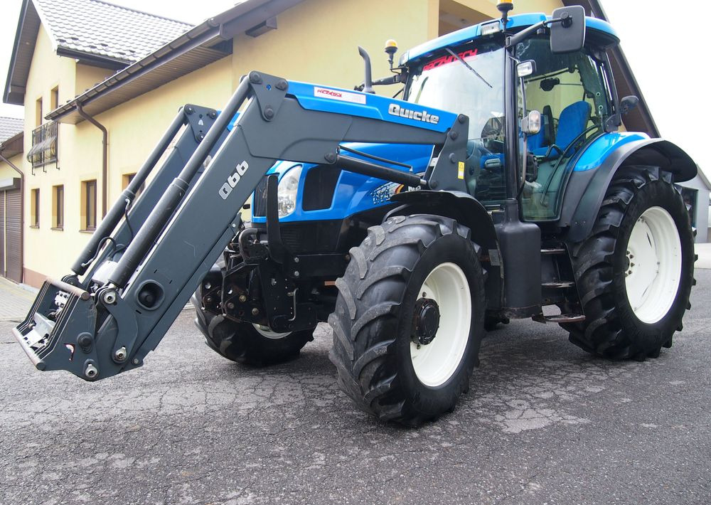 Ciągnik New Holland NH TS125A 6 cylindrów 2004 Ciągnik rolniczy New Holland TS125A - Traktor: slika 1 Ciągnik New Holland NH TS125A 6 cylindrów 2004 Ciągnik rolniczy New Holland TS125A - Traktor: slika 1