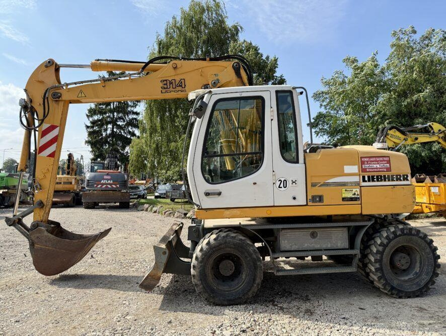 Liebherr A314 - Bager točkaš: slika 1 Liebherr A314 - Bager točkaš: slika 1