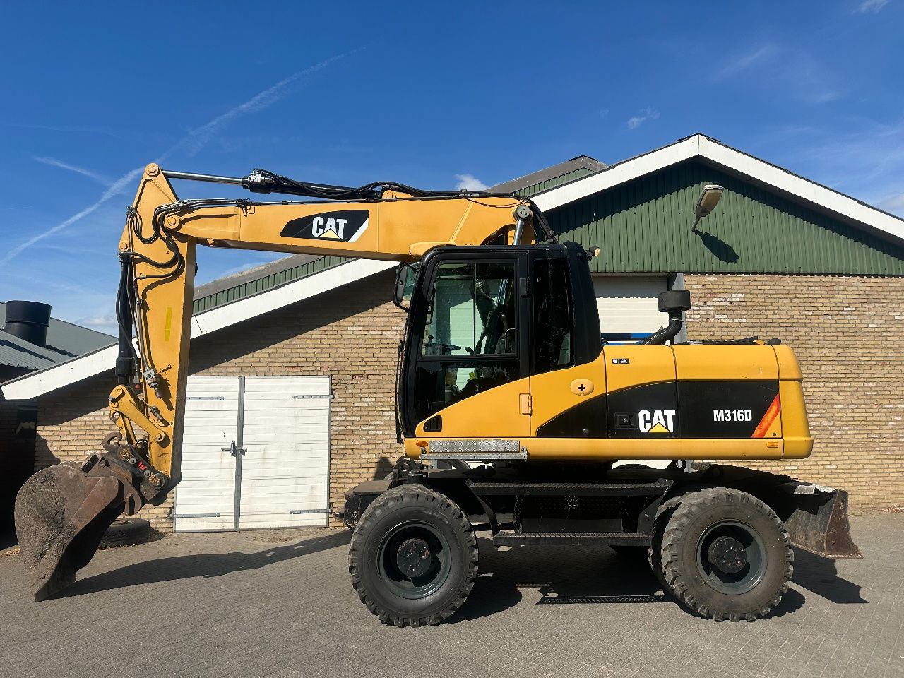 Caterpillar M316D - Utovarivač točkaš: slika 1 Caterpillar M316D - Utovarivač točkaš: slika 1