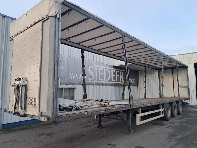 Fliegl 3x Ror Axle , Flat Trailer - Poluprikolica sa ceradom: slika 1 Fliegl 3x Ror Axle , Flat Trailer - Poluprikolica sa ceradom: slika 1