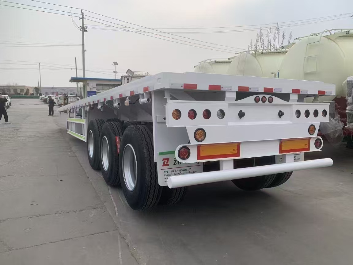 ZHICHENG Semi Flat Bed Low Bed Lowboy bed truck in New or Used Condition and various Size for Sale - Niska poluprikolica za prevoz: slika 3 ZHICHENG Semi Flat Bed Low Bed Lowboy bed truck in New or Used Condition and various Size for Sale - Niska poluprikolica za prevoz: slika 3