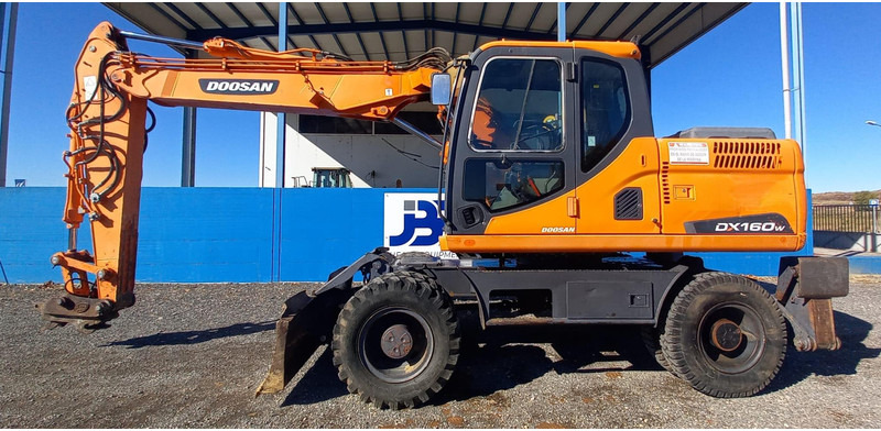 Doosan DX140W-3 - Bager točkaš: slika 1 Doosan DX140W-3 - Bager točkaš: slika 1