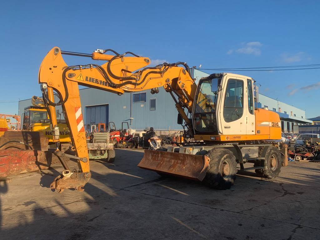 Liebherr A 314 Litronic - Bager točkaš: slika 1 Liebherr A 314 Litronic - Bager točkaš: slika 1