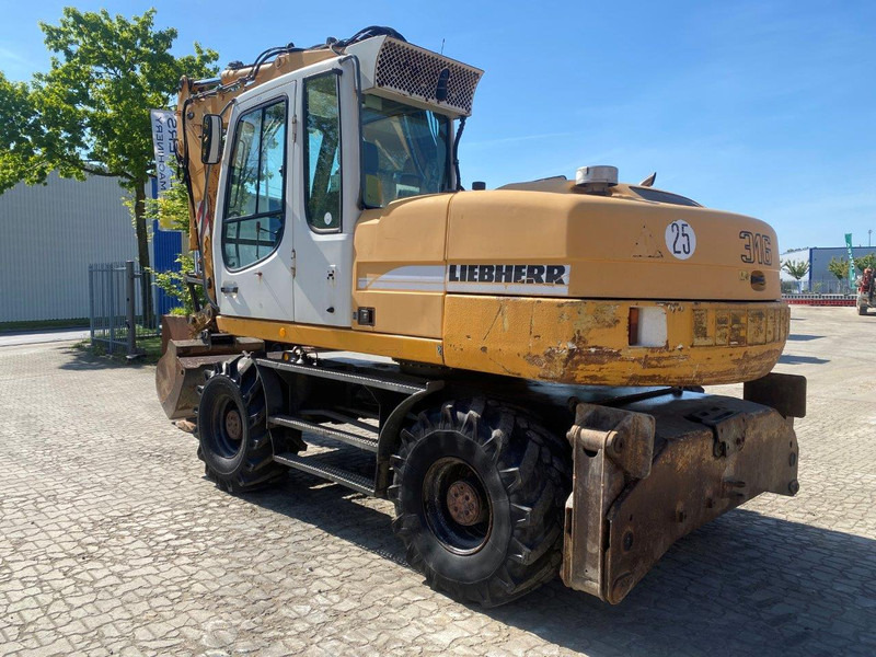 Liebherr A316 Litronic A 316 litronic - Bager točkaš: slika 1 Liebherr A316 Litronic A 316 litronic - Bager točkaš: slika 1