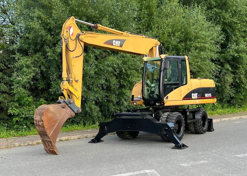 Caterpillar CAT M315C  CATERPILLAR SPROWADZONY  Bardzo Dobry Stan - Bager točkaš: slika 1 Caterpillar CAT M315C  CATERPILLAR SPROWADZONY  Bardzo Dobry Stan - Bager točkaš: slika 1