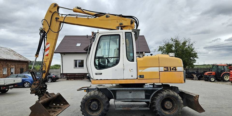 Koparka kołowa Liebherr A314 Litronic 9350 h+ 5 łyżek kołówka - Bager točkaš: slika 1 Koparka kołowa Liebherr A314 Litronic 9350 h+ 5 łyżek kołówka - Bager točkaš: slika 1