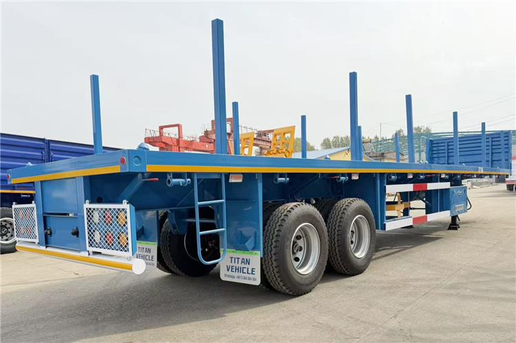 TITAN 2 Axle Wood Log Trailer Flatbed Trailer for Sale In Zimbabwe - Poluprikolica šticarka: slika 1 TITAN 2 Axle Wood Log Trailer Flatbed Trailer for Sale In Zimbabwe - Poluprikolica šticarka: slika 1