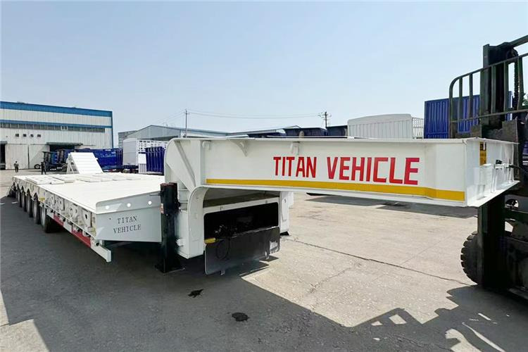 TITAN 5 Axle 100 Ton Low Bed Trailer for Sale In Tanzania - Niska poluprikolica za prevoz: slika 5 TITAN 5 Axle 100 Ton Low Bed Trailer for Sale In Tanzania - Niska poluprikolica za prevoz: slika 5