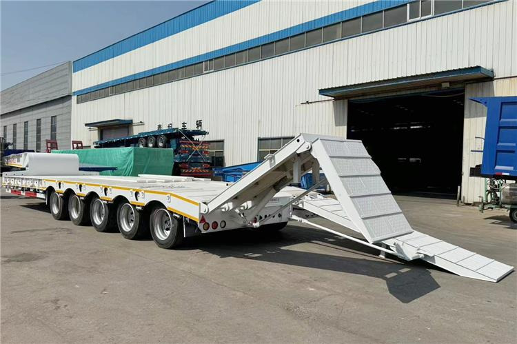 TITAN 5 Axle 100 Ton Low Bed Trailer for Sale In Tanzania - Niska poluprikolica za prevoz: slika 1 TITAN 5 Axle 100 Ton Low Bed Trailer for Sale In Tanzania - Niska poluprikolica za prevoz: slika 1