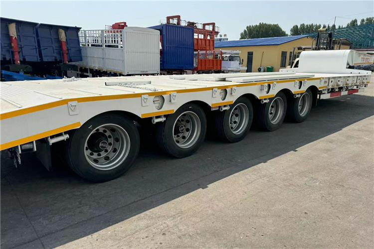 TITAN 5 Axle 100 Ton Low Bed Trailer for Sale In Tanzania - Niska poluprikolica za prevoz: slika 3 TITAN 5 Axle 100 Ton Low Bed Trailer for Sale In Tanzania - Niska poluprikolica za prevoz: slika 3