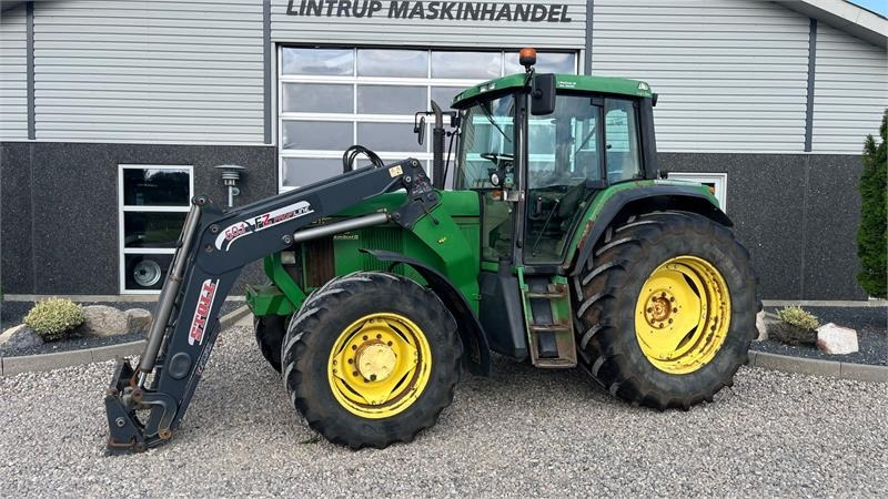 John Deere 6910 Auto Quad II-TLS Med frontlæsser - Traktor: slika 1 John Deere 6910 Auto Quad II-TLS Med frontlæsser - Traktor: slika 1
